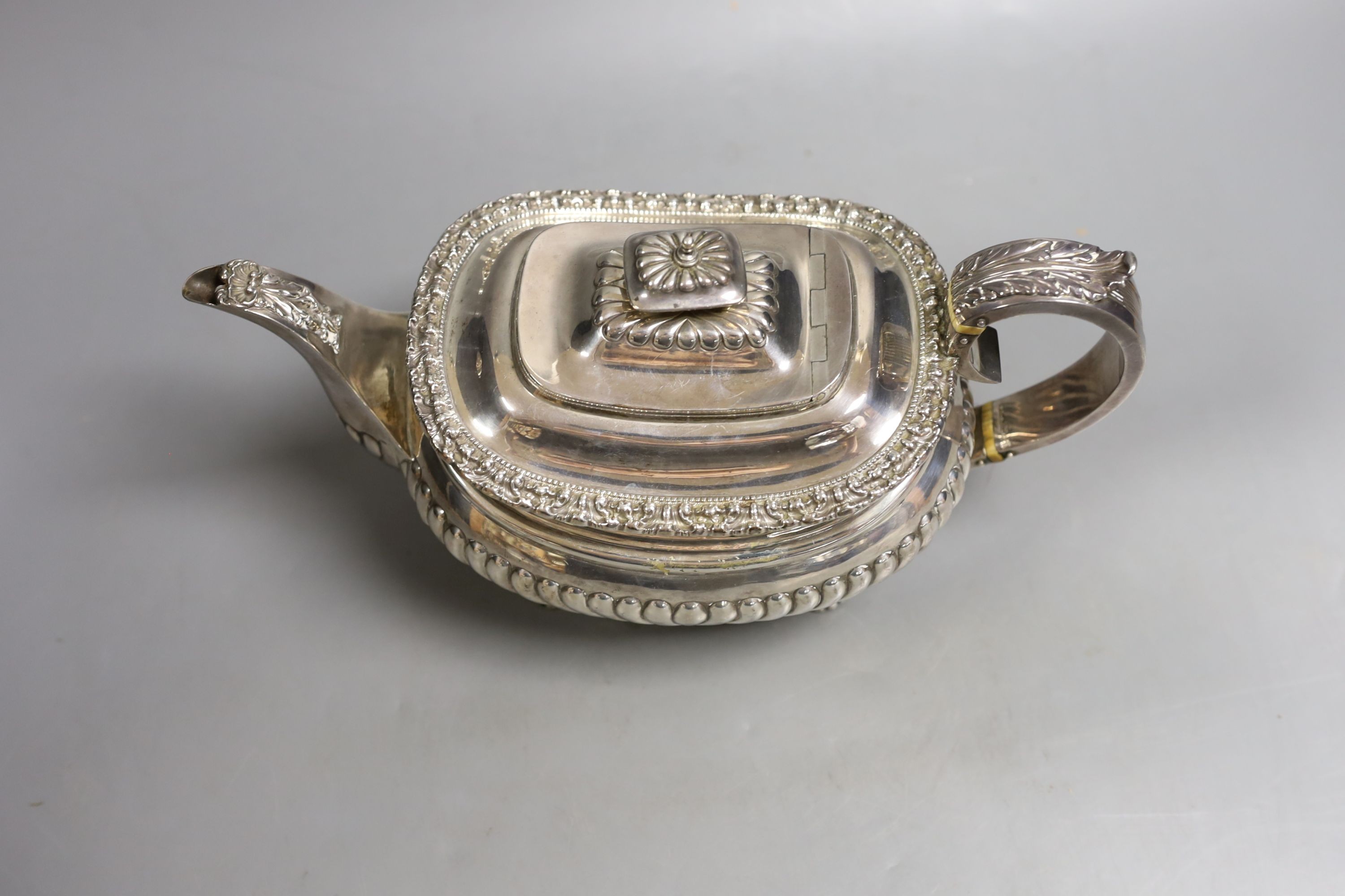 A George IV demi-fluted silver teapot, by John & Thomas Settle, Sheffield, 1824, gross weight 23.5oz (patch to base).